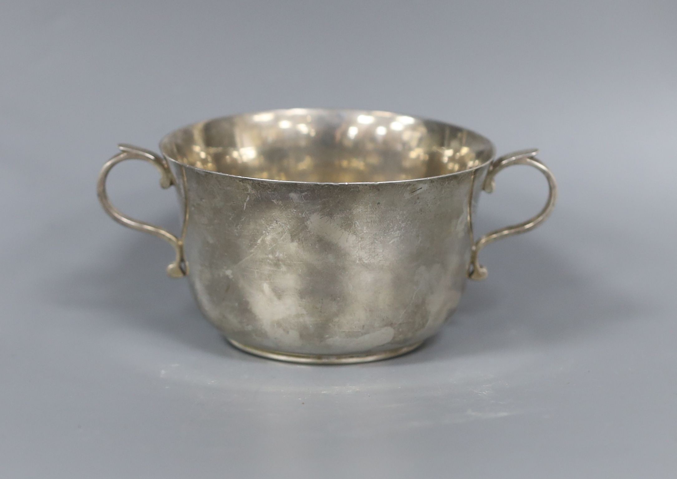 A silver sugar bowl, pair of silver bun salts and a silver mustard pot.